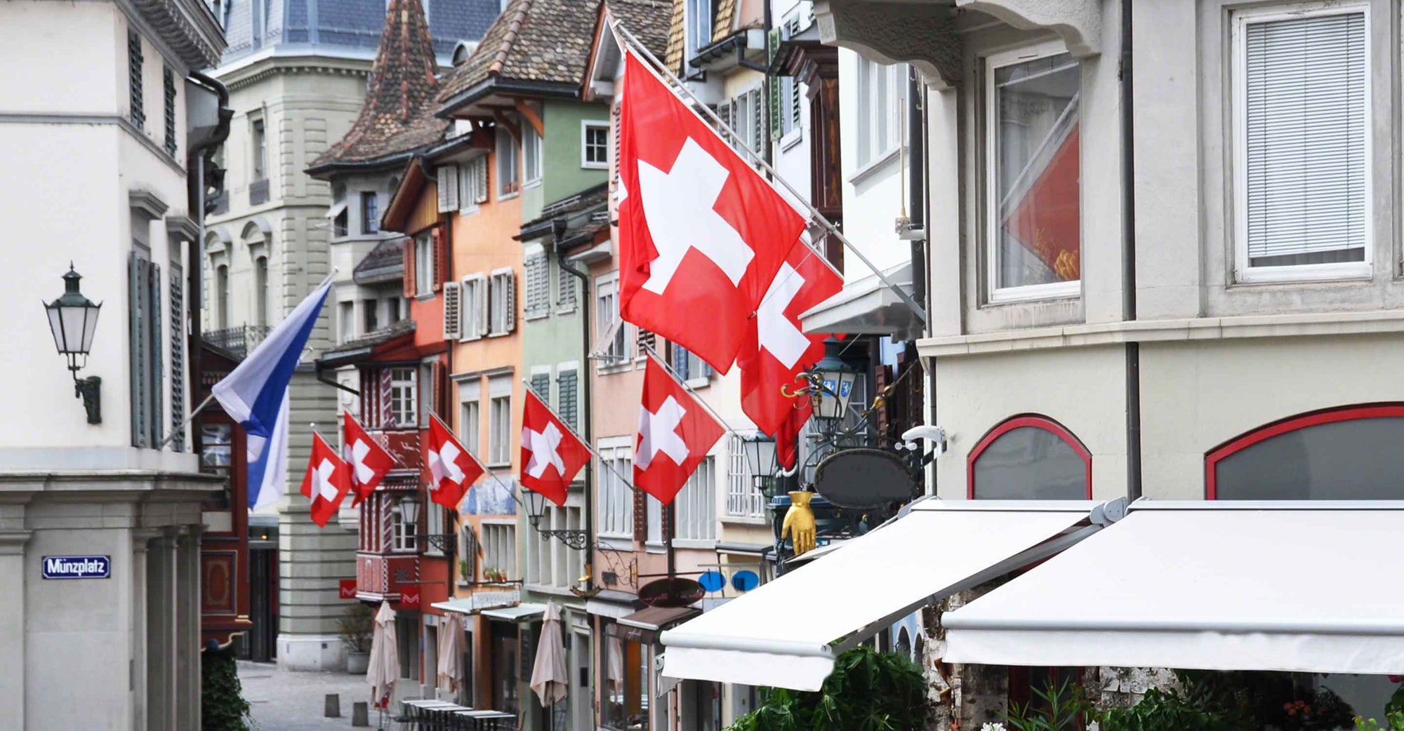 Swiss flags hanging on buildings