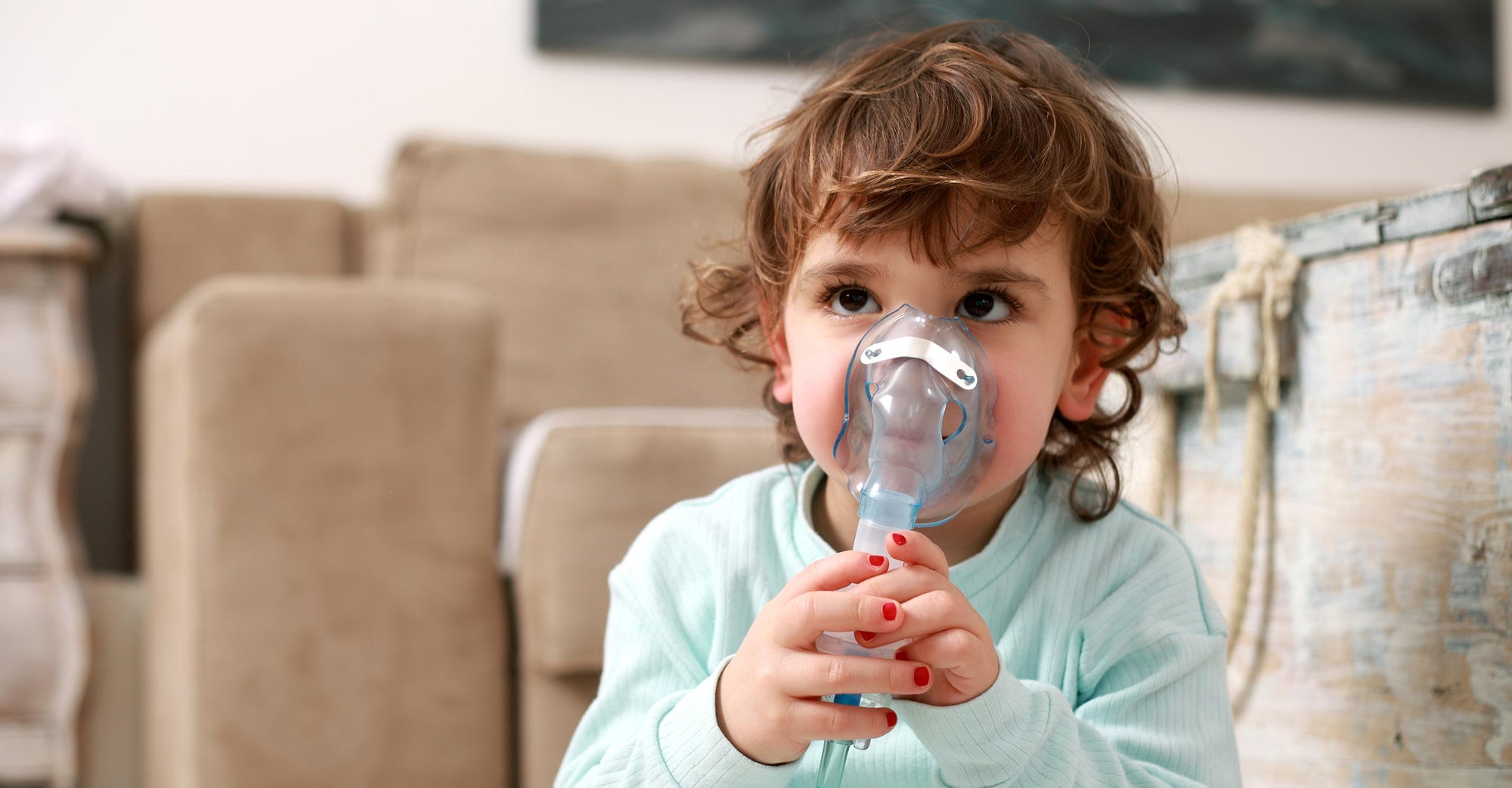 Young child with oxygen mask