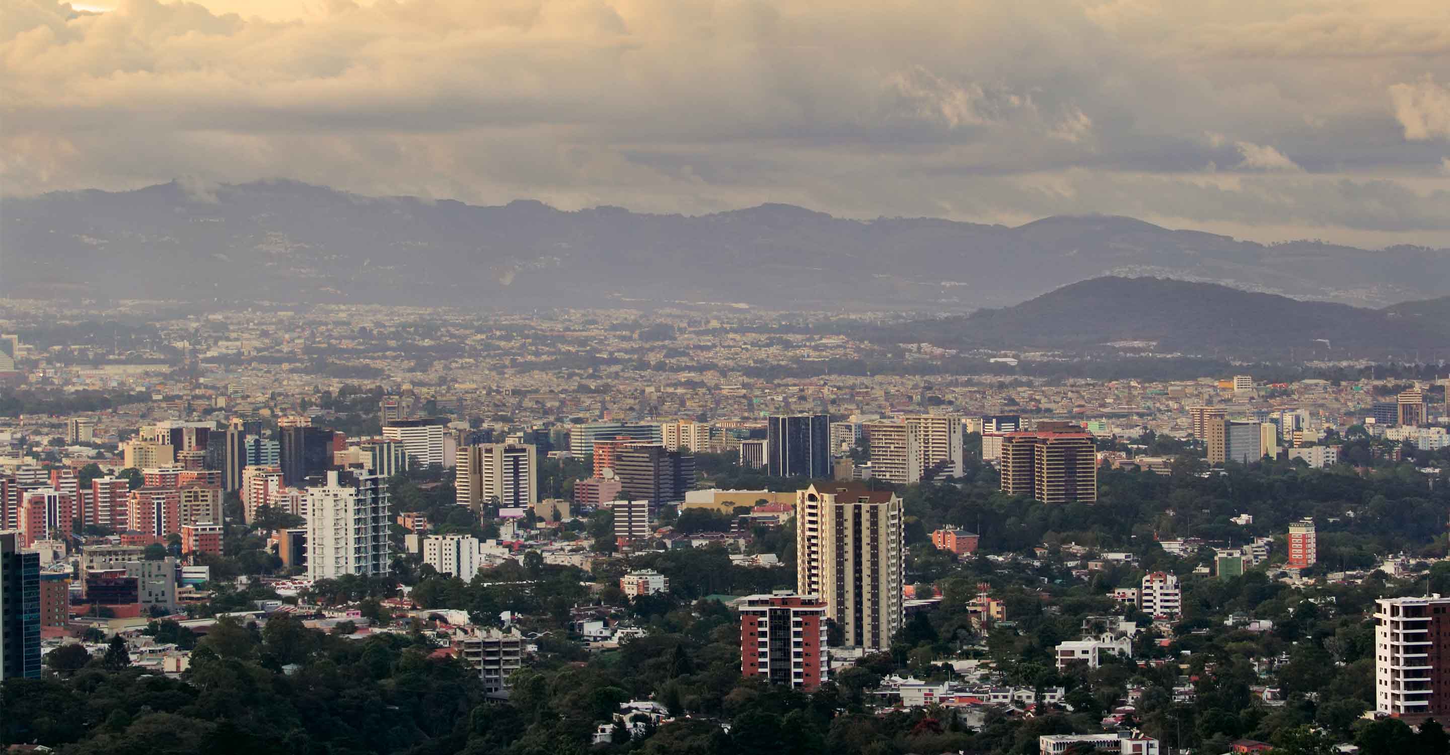 buildings in front of mountains