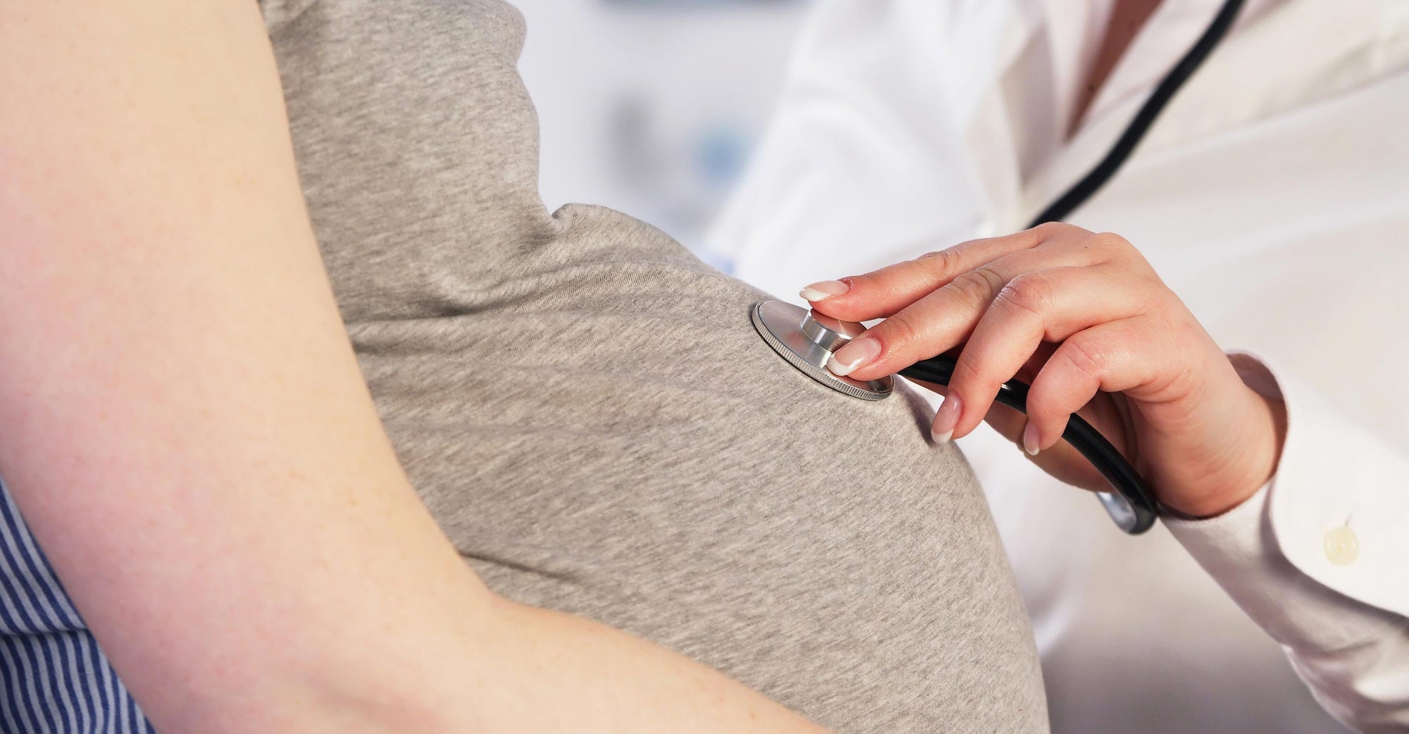 doctor examining pregnant woman 