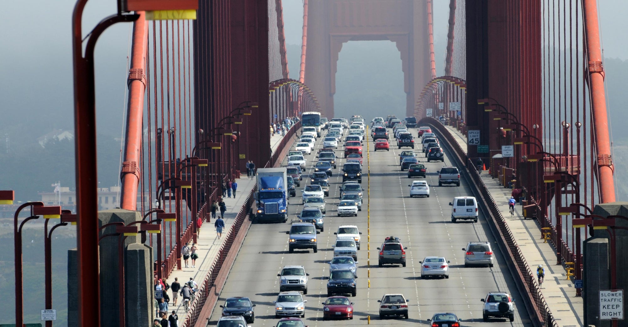 cars driving over Golden Gate Bridge