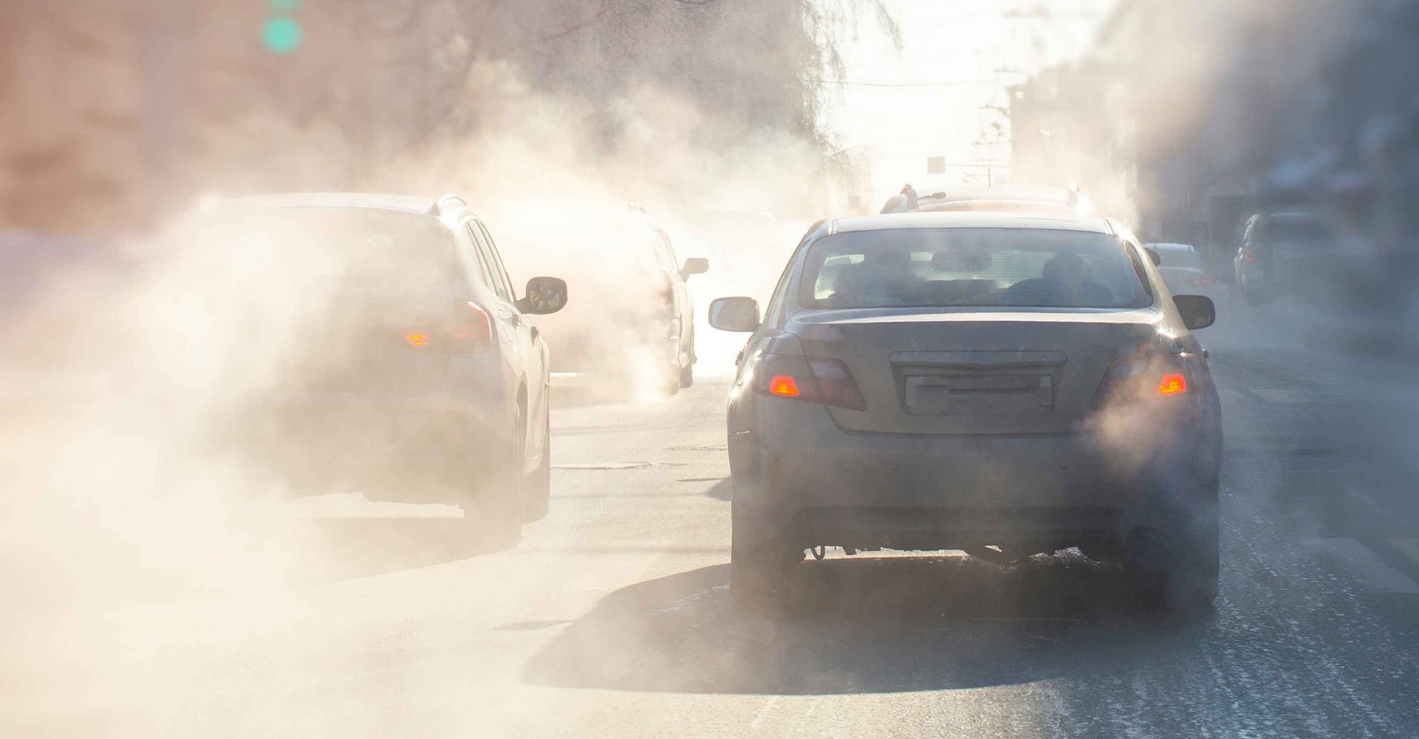 cars and exhaust on road