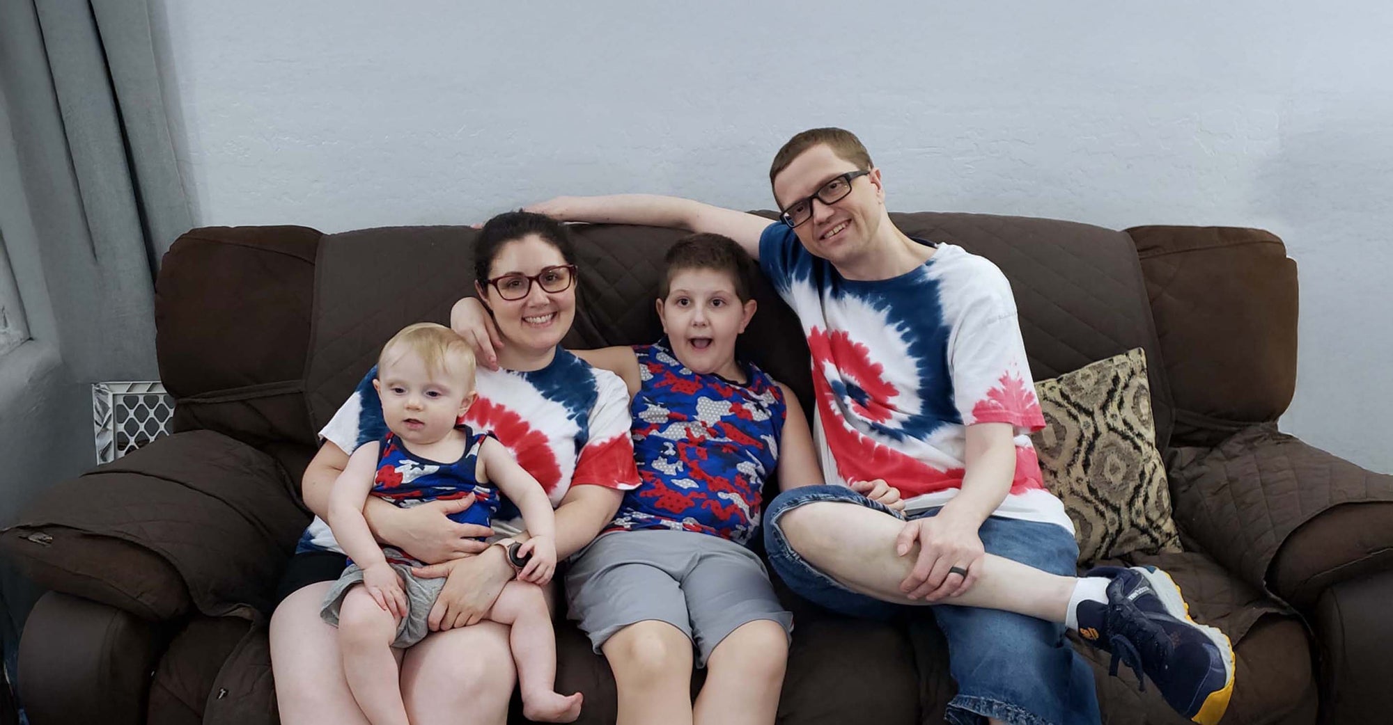 family sitting on couch