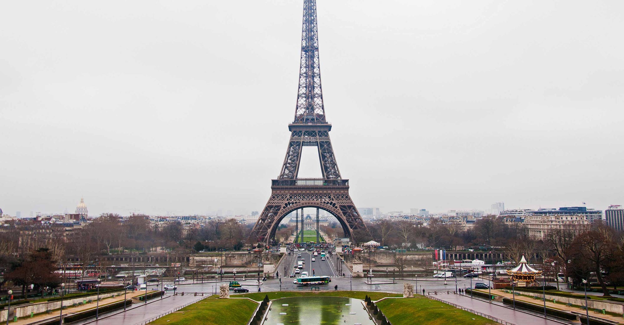 Eiffel Tower in Paris on a rainy day with clearly hazy background.