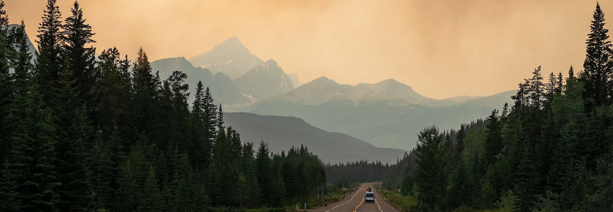 wildfire smoke rising over mountains near Alberta Canada