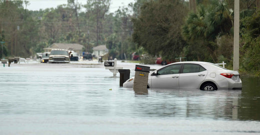 Stalled cars on a flooded street