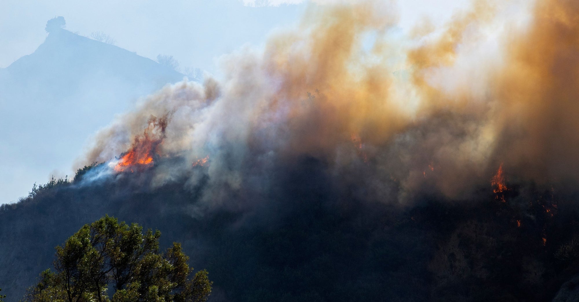 Smoke and fire on a mountaintop