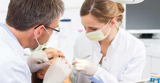 dentists examining patient