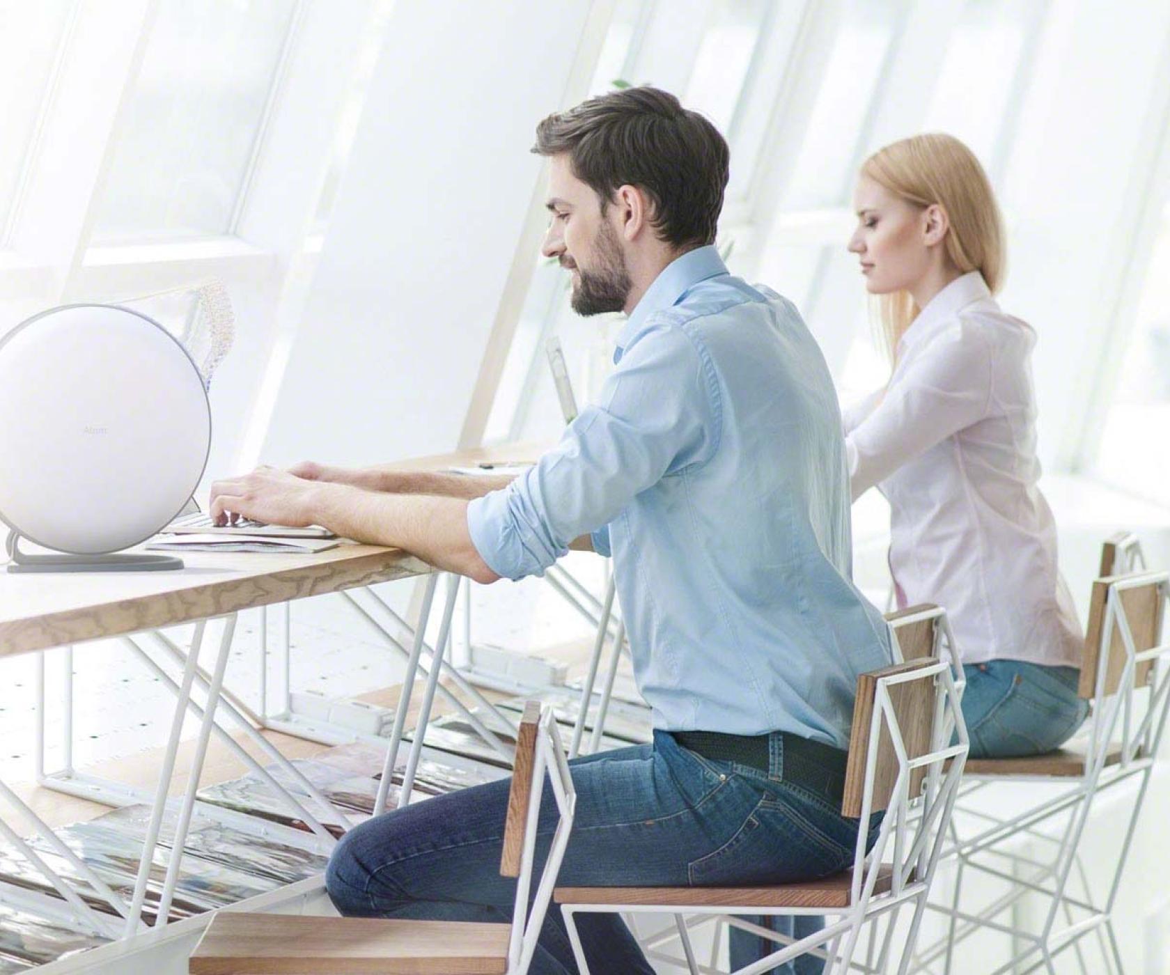 Atem desk on desk with man and woman working