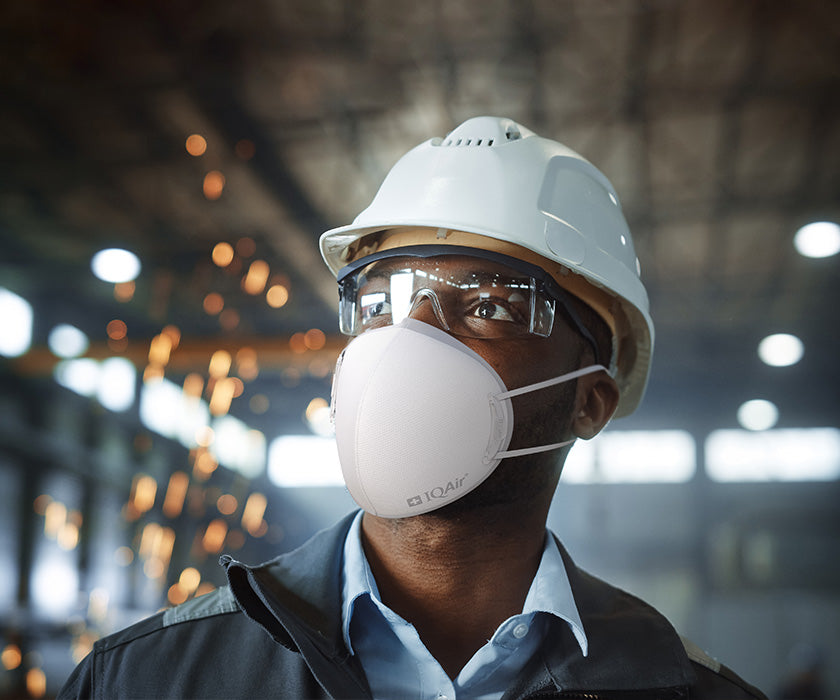 Worker wearing IQAir mask