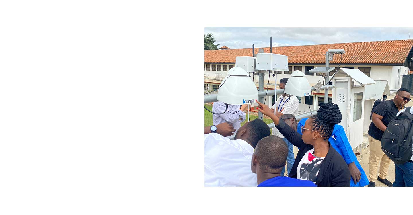 Group inspecting outdoor air quality monitors